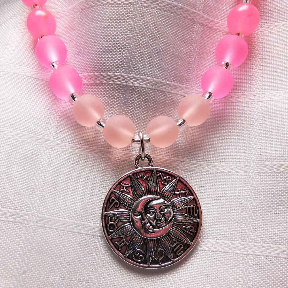 No735 Beautiful handmade long necklace with silver sun and moon pendant